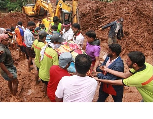 Rescue workers at the site of a landslide in Kerala